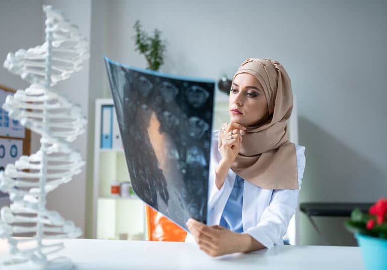 Doctor looking at xray Doctor looking at xray